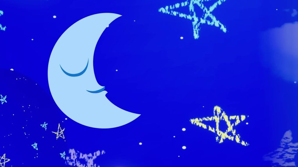 The smiling crescent Moon glows among bright stars in the night sky of the Digital Circus.
