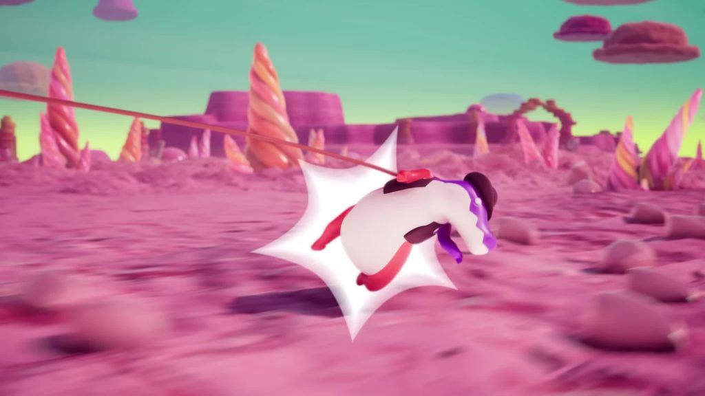 Max is yanked through the air with a comic burst effect in the candy desert of the Digital Circus.