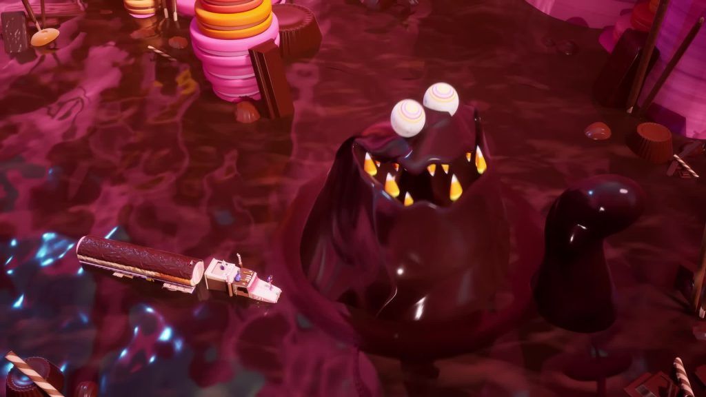 The Fudge emerges from the chocolate river surrounded by candy cliffs and a truck.
