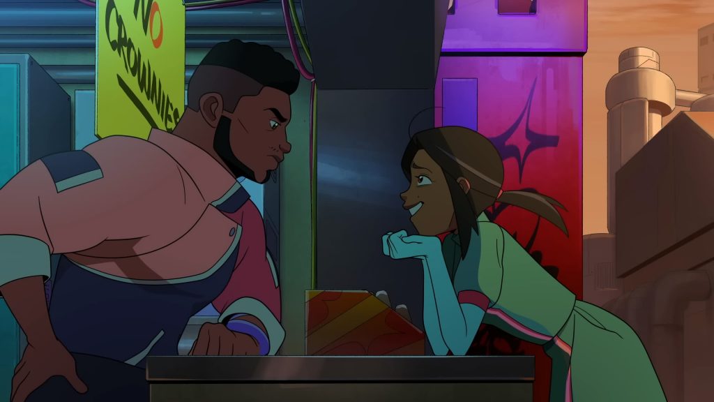 Andi leans on the counter talking with Reggie inside his vending booth in Knights of Guinevere.